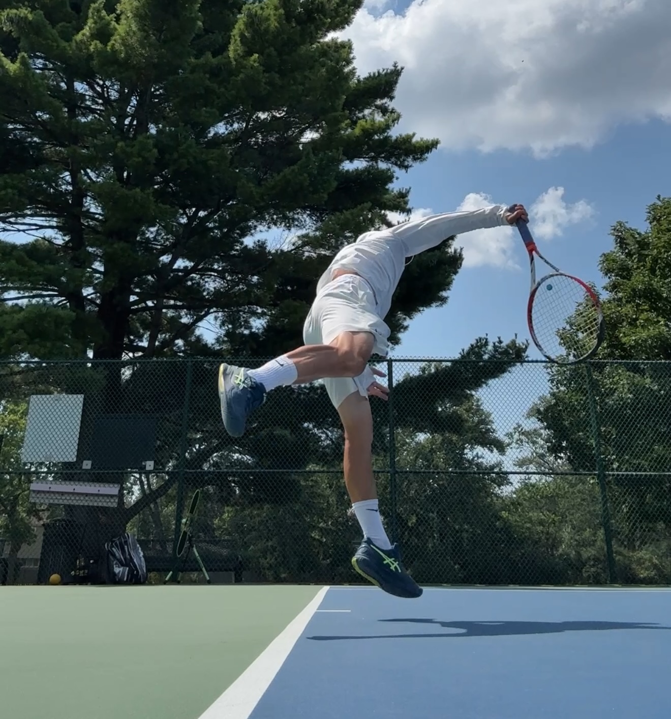Coach Mike teaching tennis